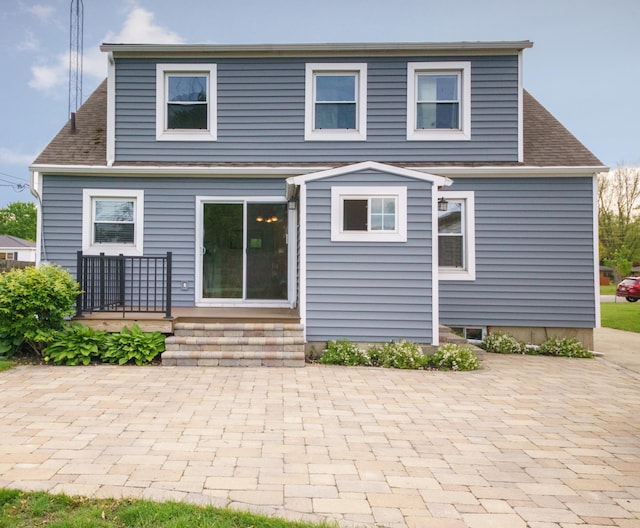 2720 Willa Dr, Saint Joseph, MI 49085 - rear view of house with a patio and a shingled roof
