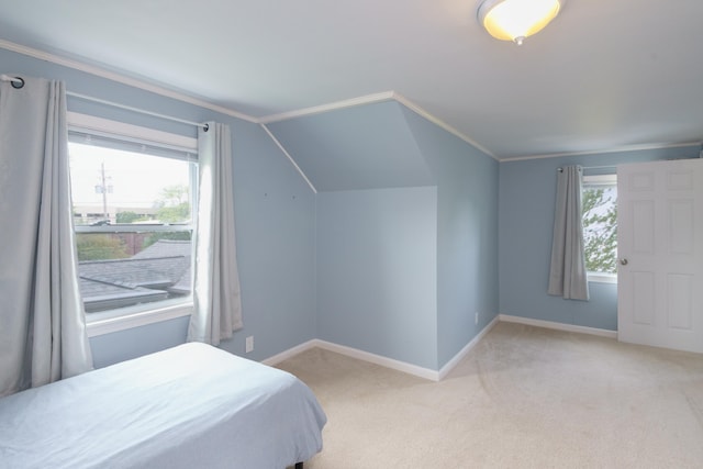 2720 Willa Dr, Saint Joseph, MI 49085 - bedroom with light carpet, baseboards, lofted ceiling, and crown molding