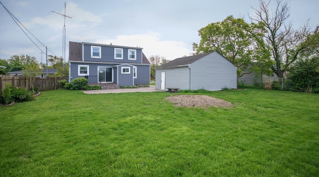 2720 Willa Dr, Saint Joseph, MI 49085 - rear view of property featuring a patio, an outbuilding, entry steps, and roof with shingles