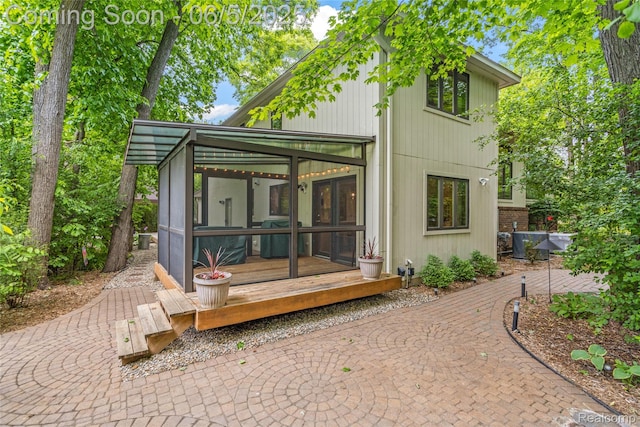 29915 Ardmore Dr, Farmington, MI 48334 - rear view of house with a sunroom