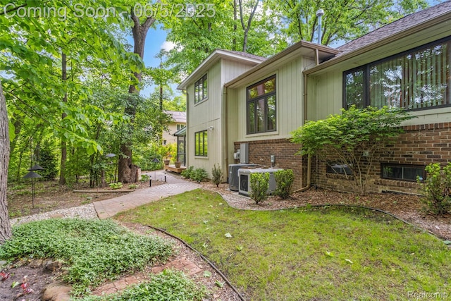 29915 Ardmore Dr, Farmington, MI 48334 - view of home's exterior featuring a lawn and brick siding