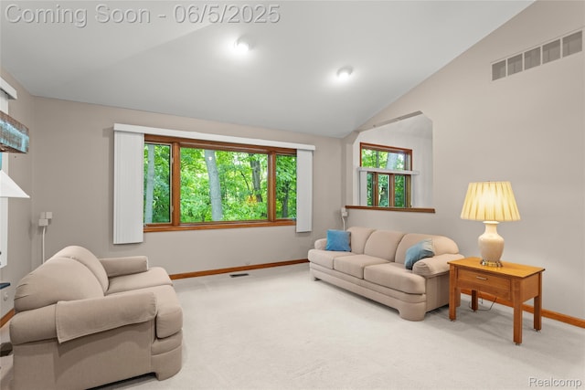 29915 Ardmore Dr, Farmington, MI 48334 - living area with baseboards, lofted ceiling, and carpet flooring
