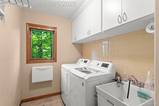 29915 Ardmore Dr, Farmington, MI 48334 - washroom featuring washer and clothes dryer, cabinet space, and baseboards