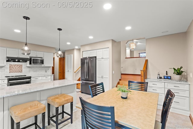 29915 Ardmore Dr, Farmington, MI 48334 - dining area featuring stairway and recessed lighting