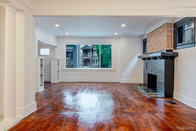 2270 W Philadelphia St, Detroit, MI 48206 - unfurnished living room with a large fireplace, ornamental molding, wood finished floors, baseboards, and recessed lighting