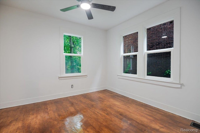 2270 W Philadelphia St, Detroit, MI 48206 - empty room featuring baseboards, dark wood-style floors, and a ceiling fan