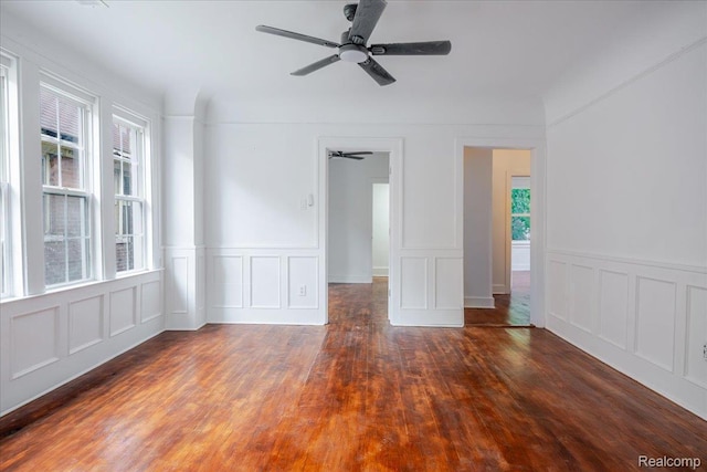 2270 W Philadelphia St, Detroit, MI 48206 - spare room with ceiling fan, wood finished floors, a decorative wall, and wainscoting