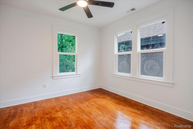 2270 W Philadelphia St, Detroit, MI 48206 - unfurnished room with baseboards, light wood-style floors, and a ceiling fan
