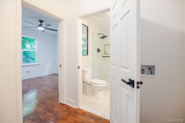 2270 W Philadelphia St, Detroit, MI 48206 - full bath featuring a marble finish shower, toilet, baseboards, ceiling fan, and wood finished floors