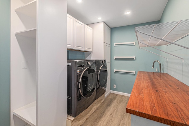 764 Allen Rd, Milan, MI 48160 - laundry area with light wood-style floors, washing machine and clothes dryer, cabinet space, recessed lighting, and baseboards