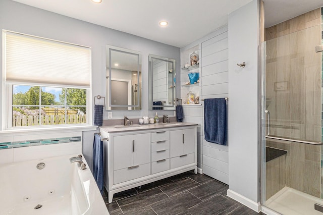 764 Allen Rd, Milan, MI 48160 - full bathroom featuring double vanity, a stall shower, a jetted tub, and recessed lighting