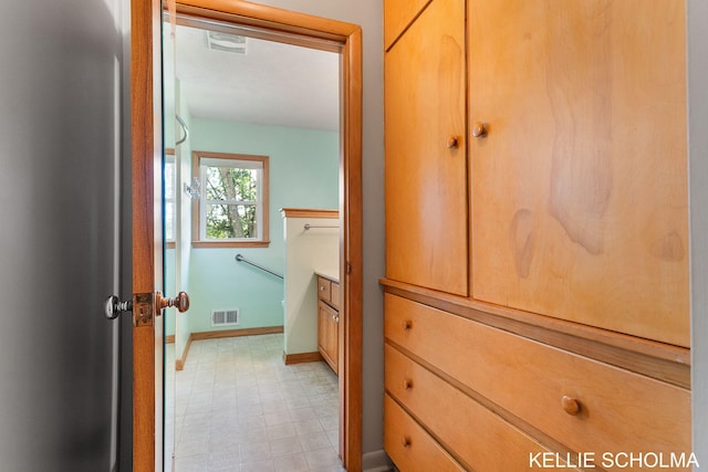 226 Palms St SW, Grand Rapids, MI 49548 - bathroom with baseboards, tile patterned floors, and vanity