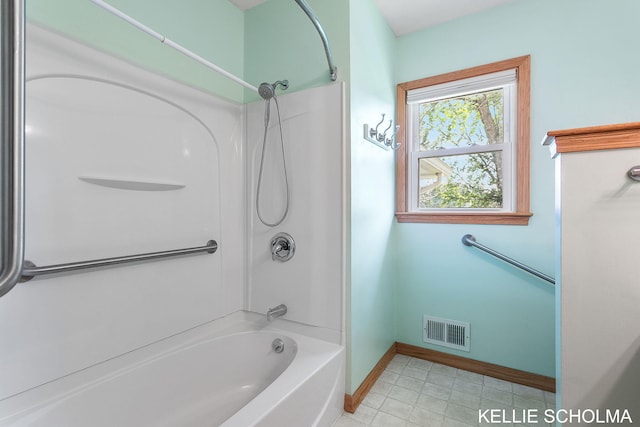 226 Palms St SW, Grand Rapids, MI 49548 - bathroom featuring baseboards and  shower combination