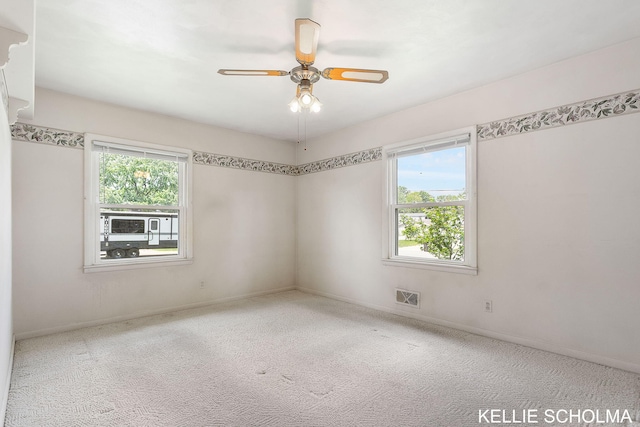 226 Palms St SW, Grand Rapids, MI 49548 - carpeted empty room with ceiling fan and baseboards