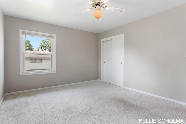 226 Palms St SW, Grand Rapids, MI 49548 - carpeted empty room featuring baseboards and a ceiling fan