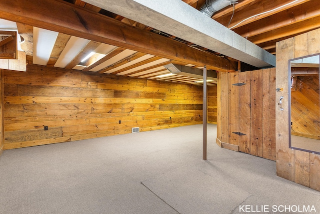 226 Palms St SW, Grand Rapids, MI 49548 - basement featuring wood walls and carpet