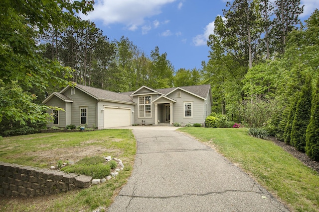 16448 Van Wagoner Rd, Spring Lake, MI 49456 - traditional-style house featuring an attached garage, driveway, a front yard, and a shingled roof