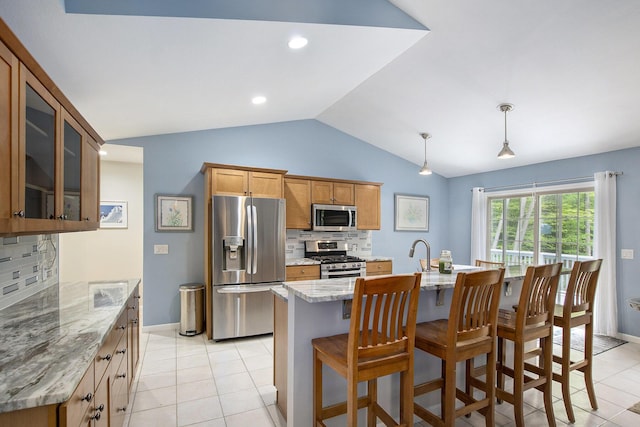 16448 Van Wagoner Rd, Spring Lake, MI 49456 - kitchen featuring appliances with stainless steel finishes, vaulted ceiling, decorative backsplash, light tile patterned floors, and glass insert cabinets