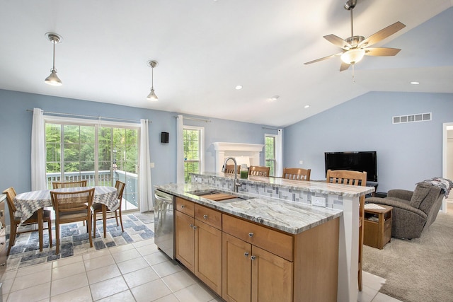 16448 Van Wagoner Rd, Spring Lake, MI 49456 - kitchen with a sink, open floor plan, stainless steel dishwasher, a center island with sink, and decorative light fixtures