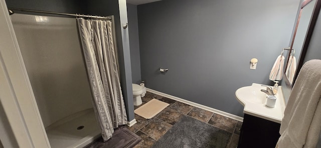16448 Van Wagoner Rd, Spring Lake, MI 49456 - full bath featuring toilet, stone tile floors, vanity, and a stall shower