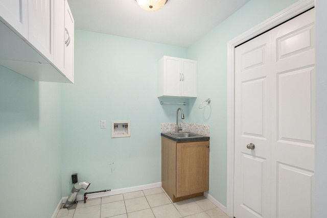 16448 Van Wagoner Rd, Spring Lake, MI 49456 - laundry area featuring washer hookup, baseboards, light tile patterned floors, and cabinet space