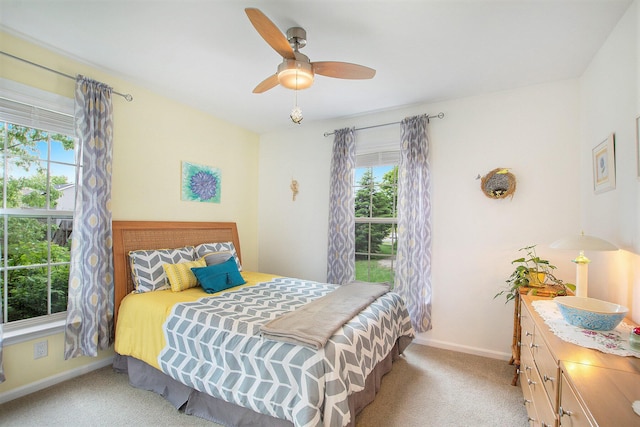 16448 Van Wagoner Rd, Spring Lake, MI 49456 - carpeted bedroom featuring multiple windows, baseboards, and a ceiling fan