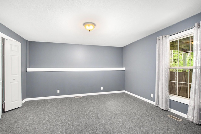 16448 Van Wagoner Rd, Spring Lake, MI 49456 - spare room featuring carpet and baseboards