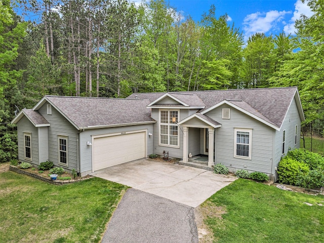 16448 Van Wagoner Rd, Spring Lake, MI 49456 - traditional-style house featuring an attached garage, driveway, a shingled roof, and a front yard