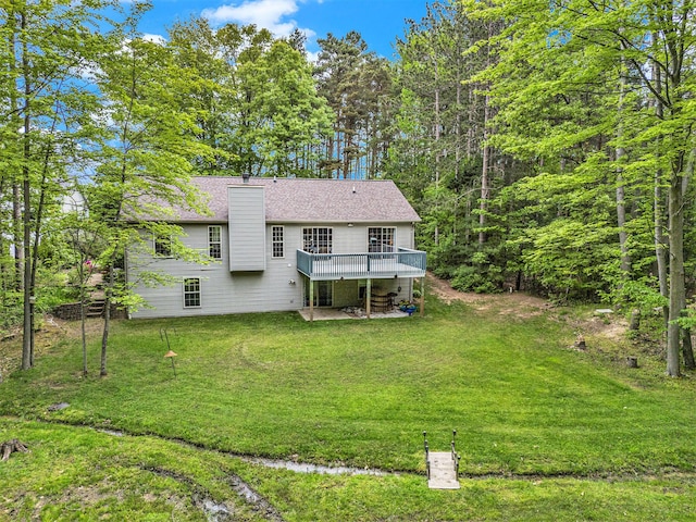16448 Van Wagoner Rd, Spring Lake, MI 49456 - back of property with a deck, a chimney, and a lawn