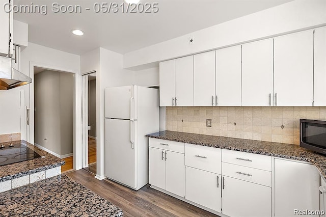 4041 W Maple Rd Apt 204, Bloomfield Hills, MI 48301 - kitchen featuring freestanding refrigerator, black electric stovetop, dark wood-style floors, white cabinets, and recessed lighting