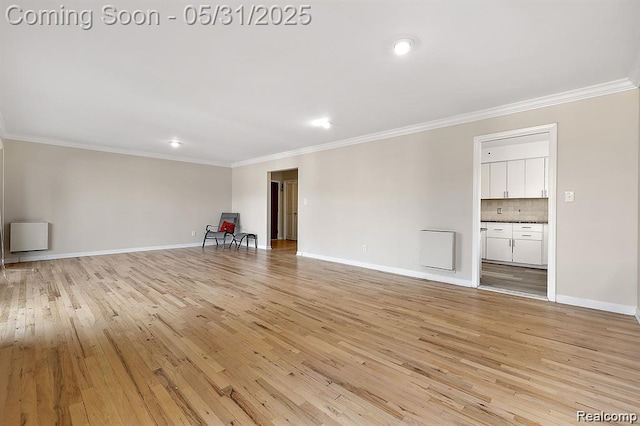 4041 W Maple Rd Apt 204, Bloomfield Hills, MI 48301 - unfurnished living room with ornamental molding, light wood finished floors, baseboards, and recessed lighting