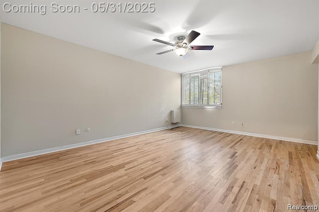 4041 W Maple Rd Apt 204, Bloomfield Hills, MI 48301 - unfurnished room with light wood finished floors, ceiling fan, and baseboards