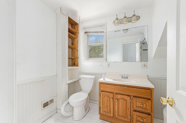 12023 Norborne, Redford, MI 48239 - bathroom with toilet, wainscoting, vanity, and tile patterned flooring