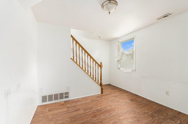 12023 Norborne, Redford, MI 48239 - unfurnished room with wood finished floors and stairs