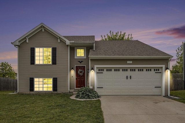 207 Station Hill St, Galesburg, MI 49053 - tri-level home featuring concrete driveway, an attached garage, and a shingled roof