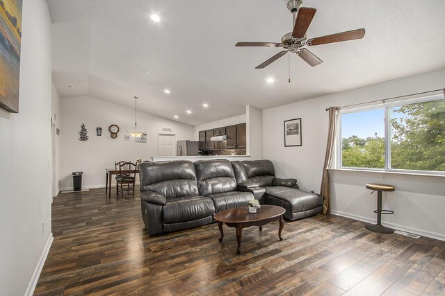 207 Station Hill St, Galesburg, MI 49053 - living area with vaulted ceiling, dark wood finished floors, ceiling fan, recessed lighting, and baseboards