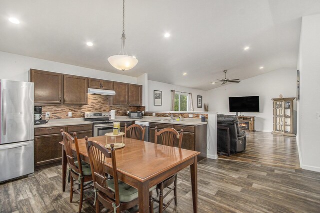 207 Station Hill St, Galesburg, MI 49053 - dining room with dark wood finished floors, a ceiling fan, lofted ceiling, and recessed lighting