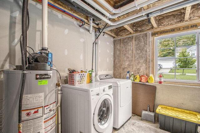 207 Station Hill St, Galesburg, MI 49053 - laundry area featuring washing machine and clothes dryer and gas water heater