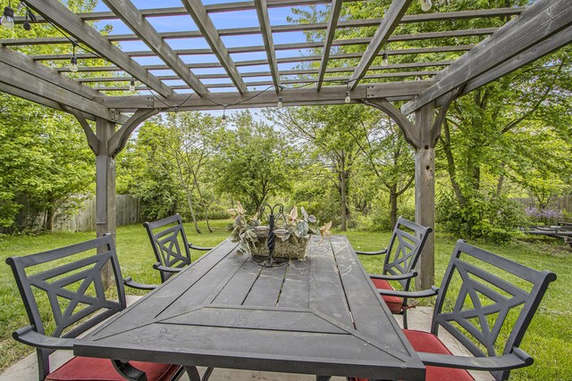 207 Station Hill St, Galesburg, MI 49053 - view of patio / terrace with outdoor dining space, a pergola, and view of scattered trees