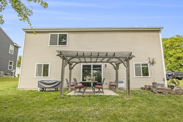 207 Station Hill St, Galesburg, MI 49053 - rear view of house featuring a pergola, a lawn, a patio area, and cooling unit