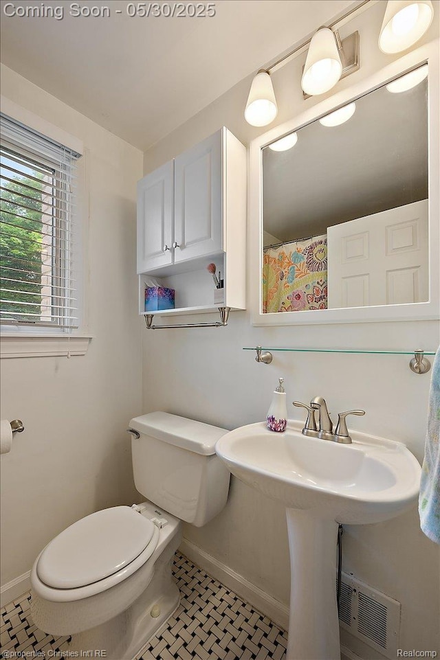 731 N Eton St, Birmingham, MI 48009 - bathroom featuring toilet and baseboards
