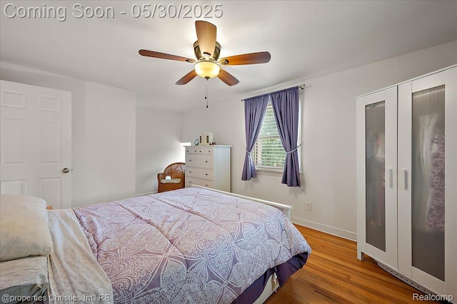 731 N Eton St, Birmingham, MI 48009 - bedroom featuring wood finished floors, baseboards, and ceiling fan