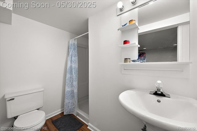 731 N Eton St, Birmingham, MI 48009 - bathroom featuring a sink, toilet, wood finished floors, and a shower with curtain