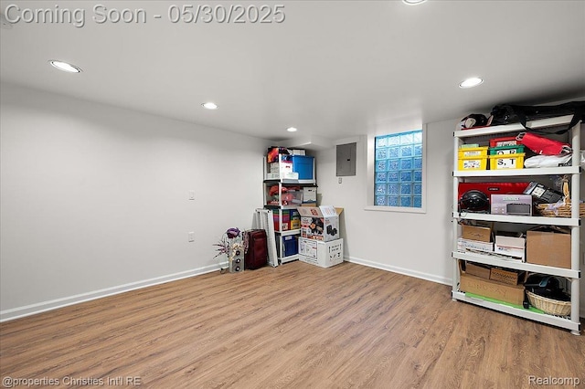 731 N Eton St, Birmingham, MI 48009 - finished basement featuring wood finished floors, electric panel, recessed lighting, and baseboards