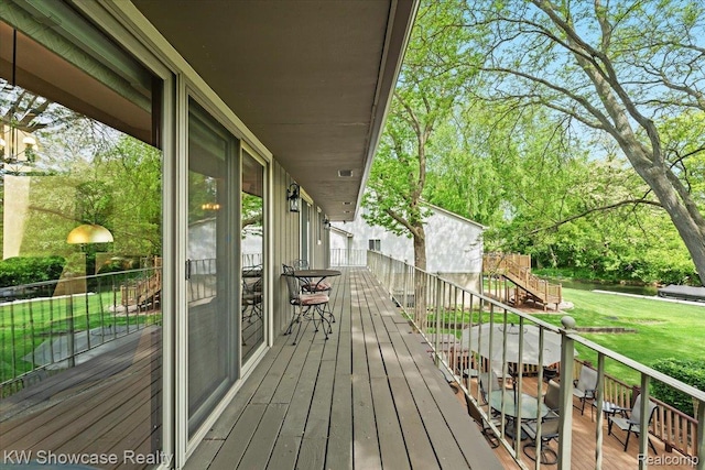 3428 Benstein Rd, Commerce Twp, MI 48382 - deck featuring a lawn, stairway, and view of scattered trees