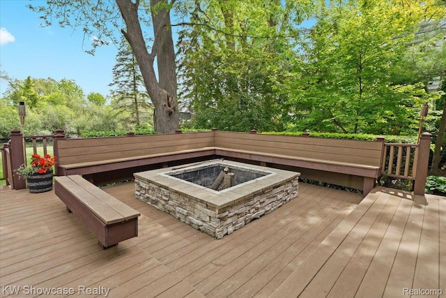 3428 Benstein Rd, Commerce Twp, MI 48382 - wooden terrace with an outdoor fire pit