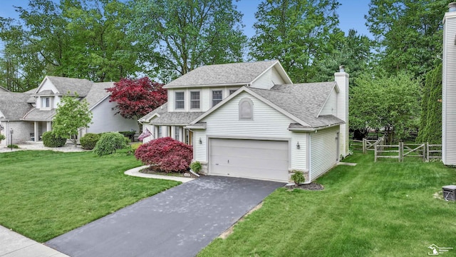 6757 Lockmill Rd, Temperance, MI 48182 - traditional home with driveway, a chimney, and a shingled roof