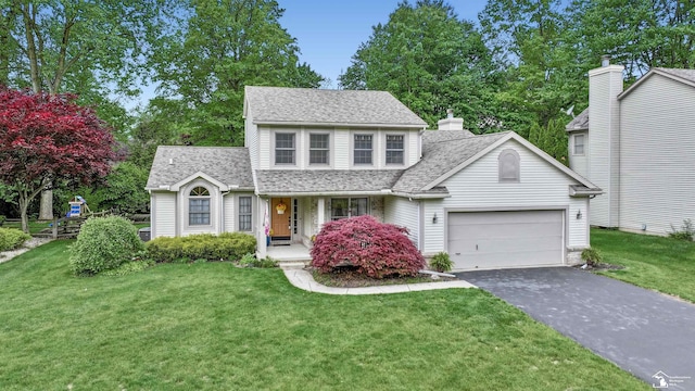 6757 Lockmill Rd, Temperance, MI 48182 - traditional-style home featuring driveway, an attached garage, a porch, and roof with shingles