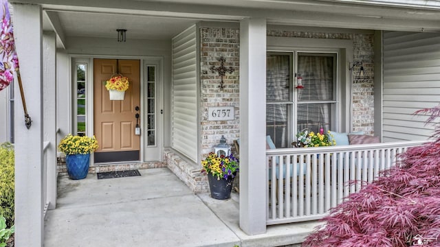 6757 Lockmill Rd, Temperance, MI 48182 - doorway to property with a porch