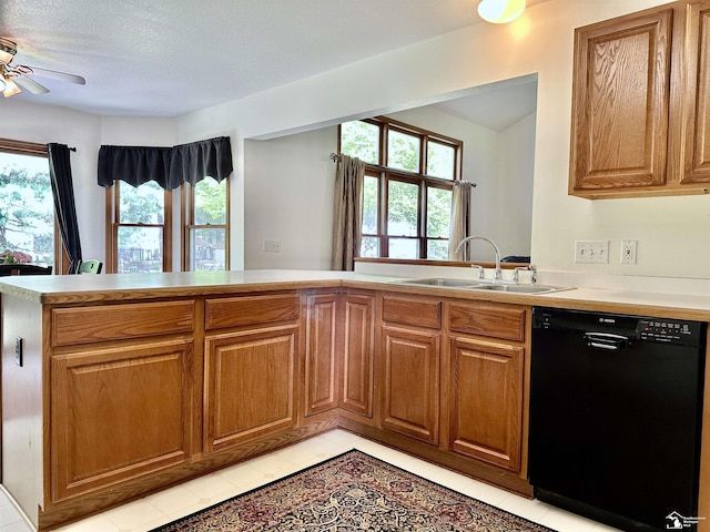 6757 Lockmill Rd, Temperance, MI 48182 - kitchen with dishwasher, a sink, a ceiling fan, brown cabinets, and light tile patterned floors